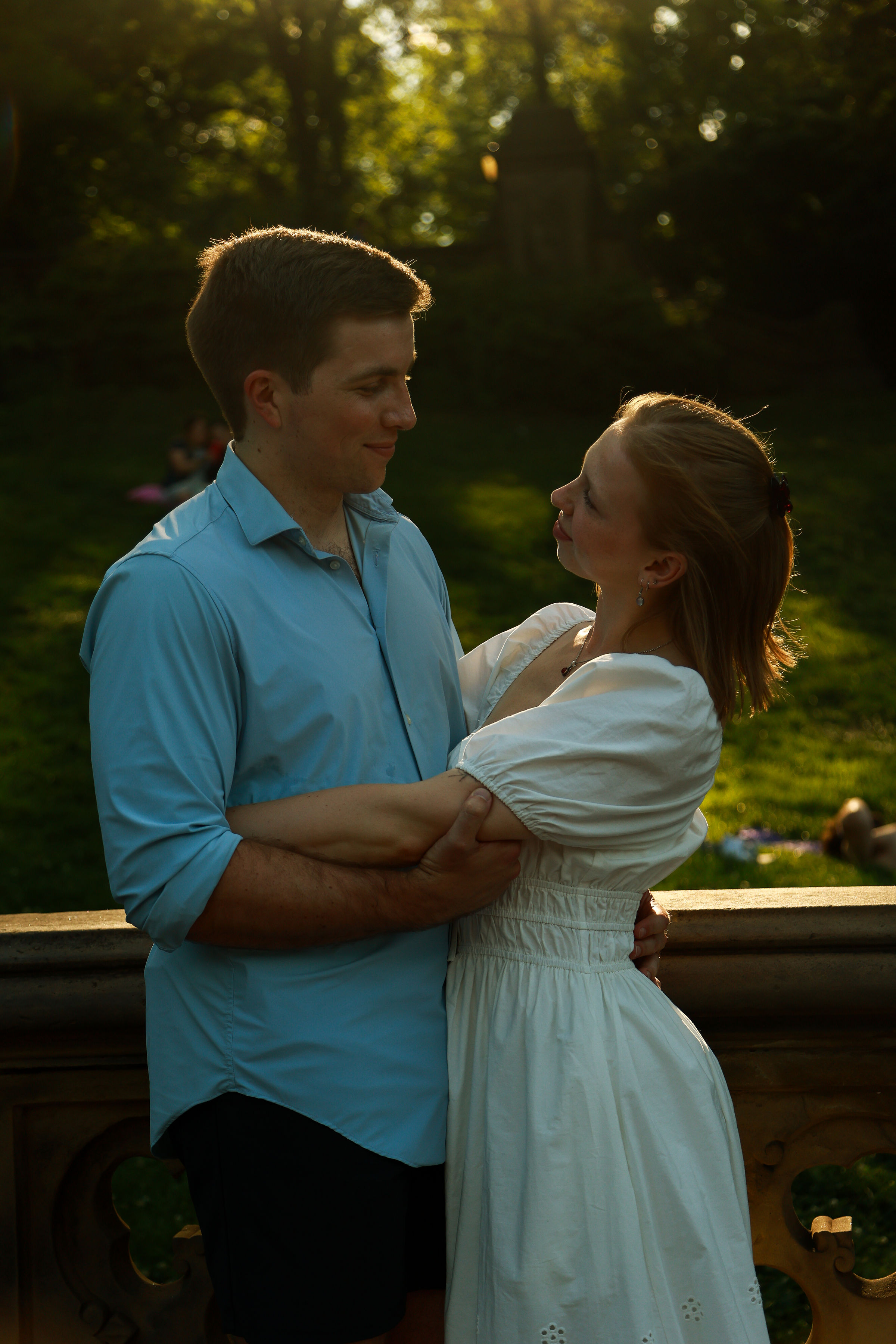 Luke and Evie holding each other in the sunlight.